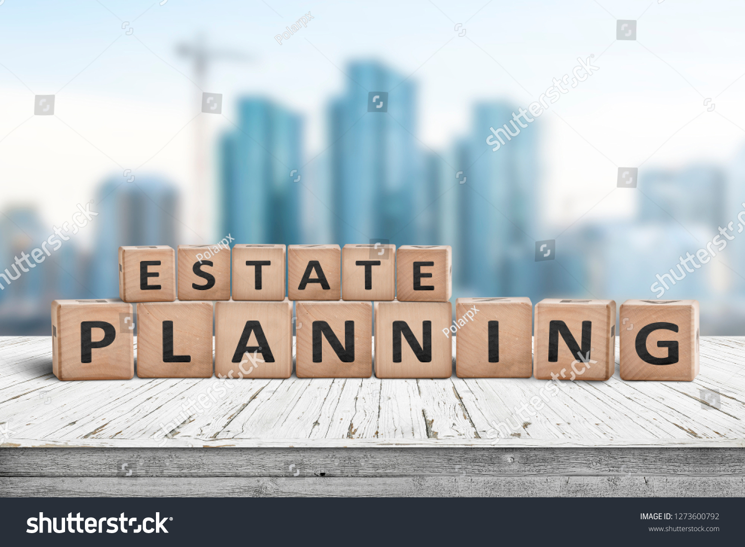 Estate planning sign on a wooden pier with tall buildings in the background #1273600792