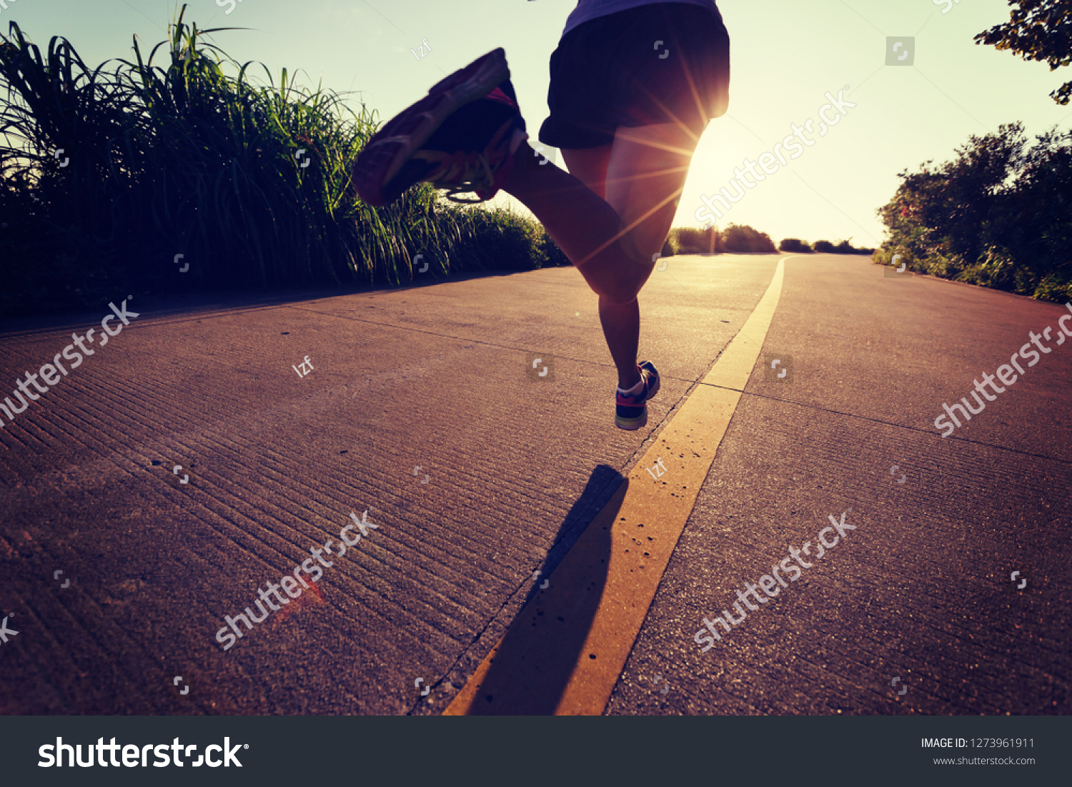 Fitness woman running on seaside trail in the morning #1273961911