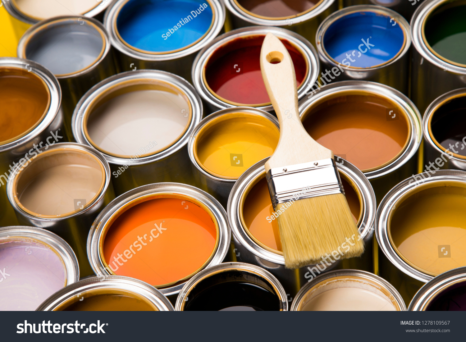 Metal tin cans with color paint and paintbrush #1278109567