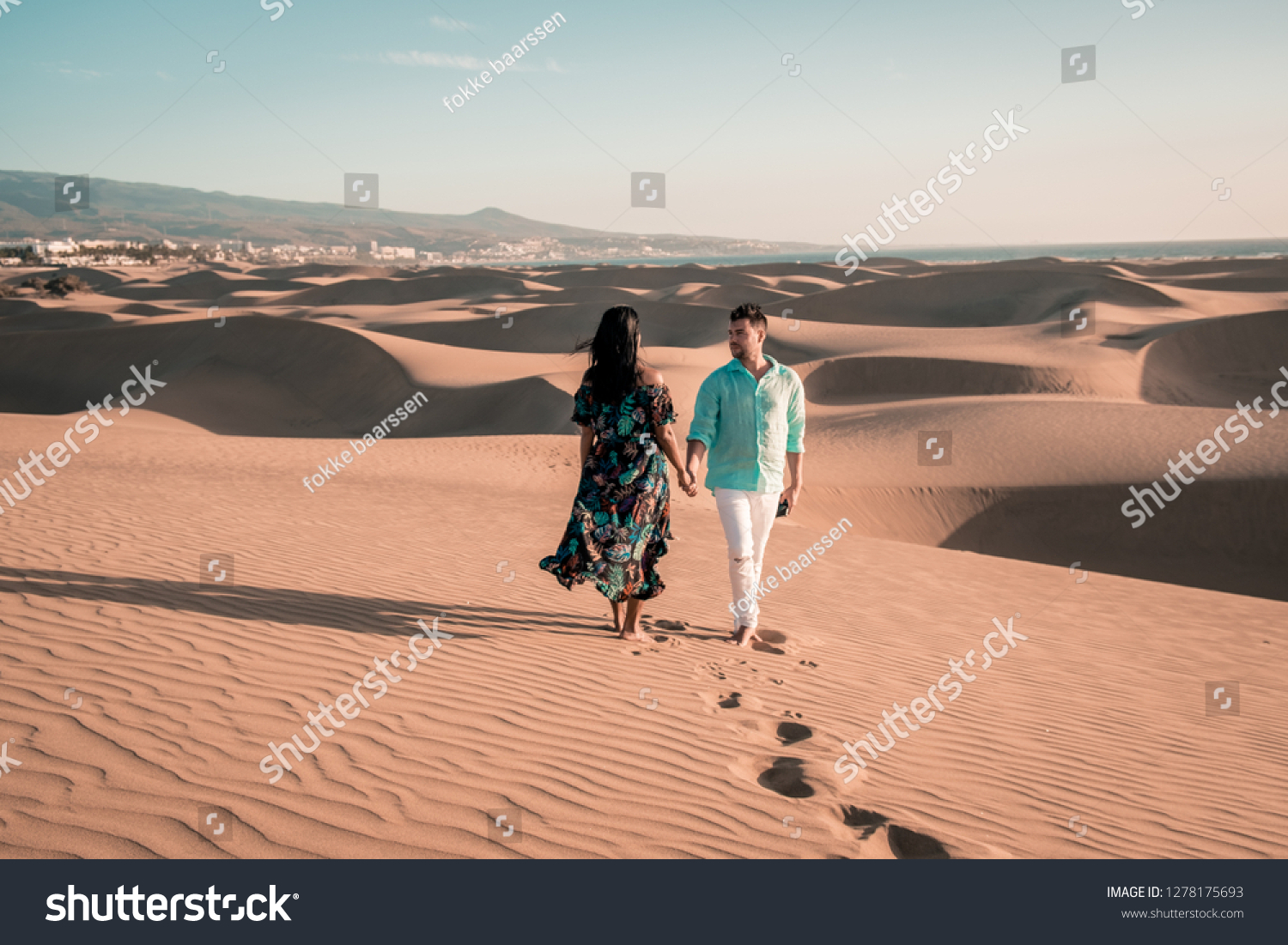 couple walking at the beach of Maspalomas Gran Canaria Spain, men and woman at the sand dunes desert of Maspalomas #1278175693