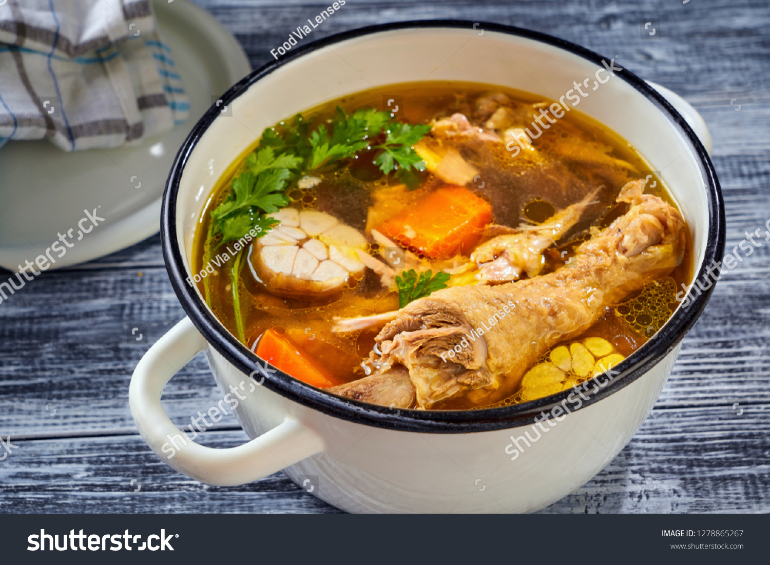 Hearty and nutritious rooster broth with vegetable #1278865267