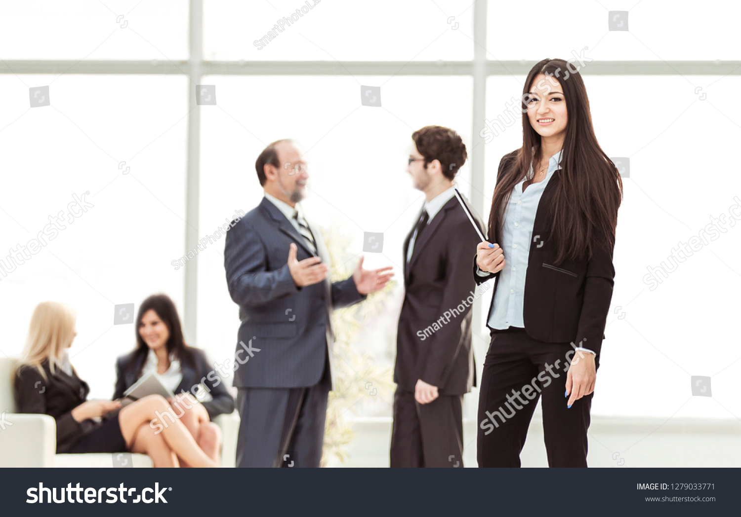 Manager of the company with documents on the background of the company's employees #1279033771