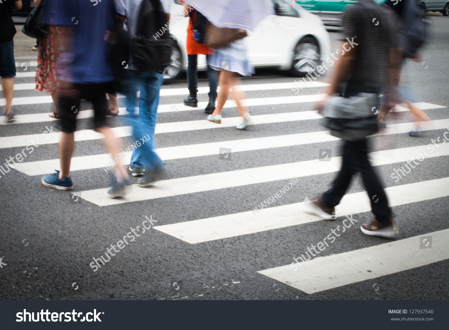 Busy city street people on zebra crossing #127937540