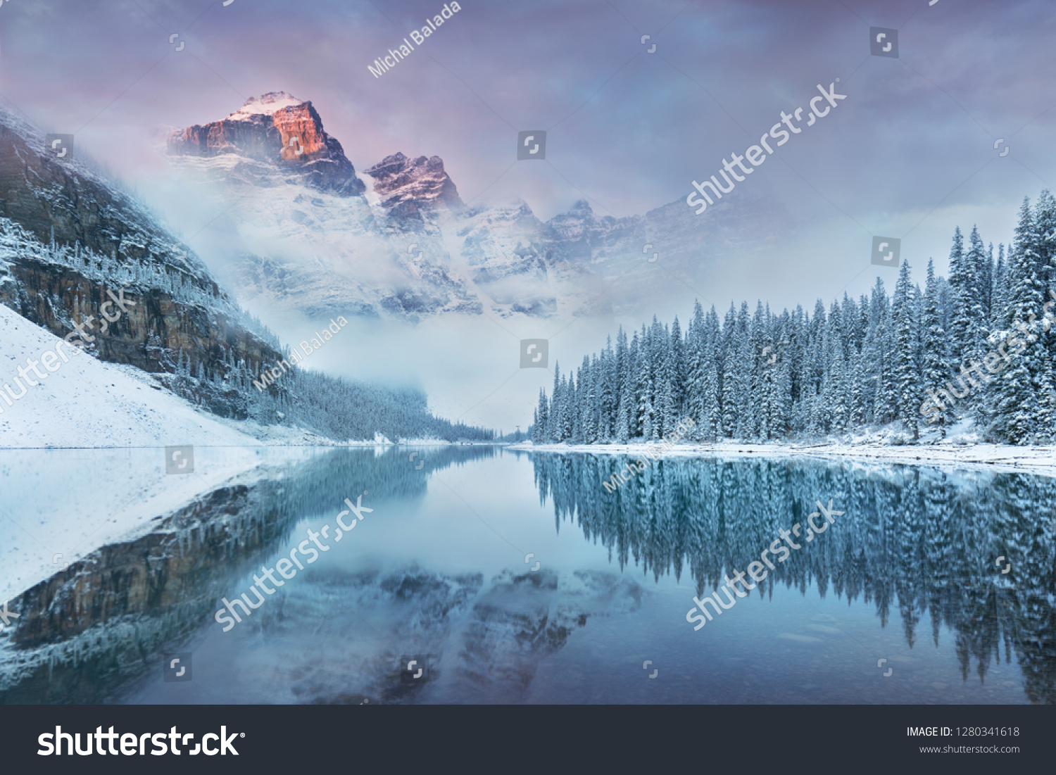 First snow Morning at Moraine Lake in Banff National Park Alberta Canada
Snow-covered winter mountain lake in a winter atmosphere. Beautiful background photo #1280341618