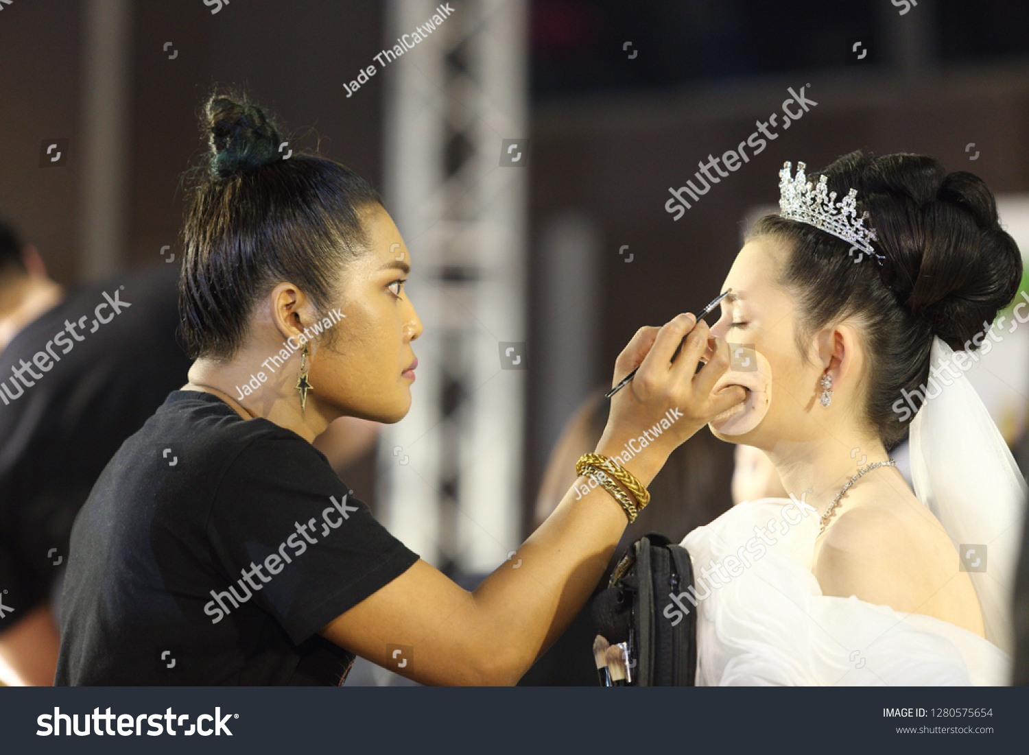 Bangkok, Thailand - January 9, 2019 ; Make Up Artists Contestant start to make up creative design wedding style to Model face on catwalk stage "Lifeford Bridal Make Up Contest" at Central Department #1280575654