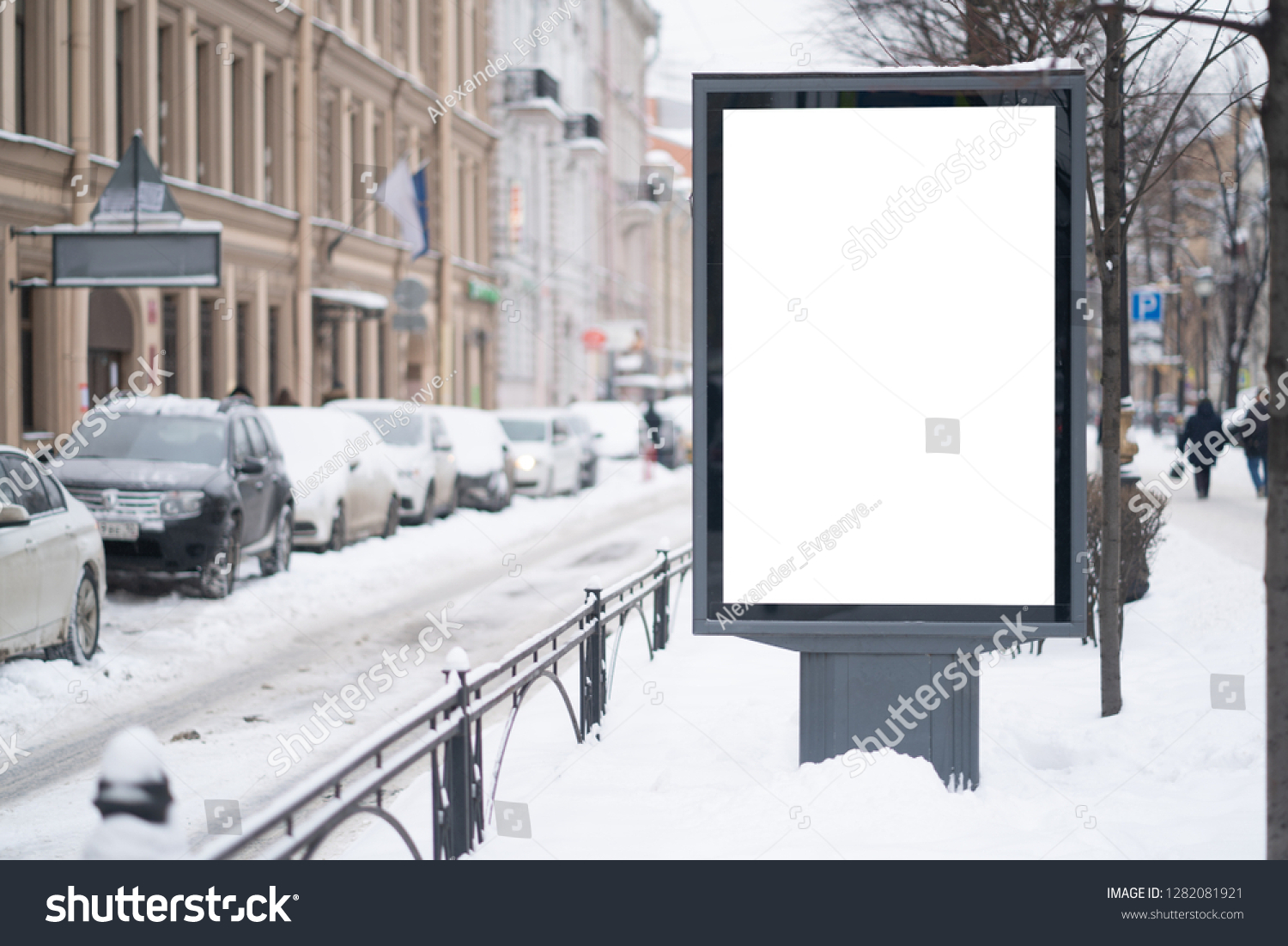 Vertical mock-up of city poster winter city with thick edges, blank white billboard in urban settings, empty street information placeholder on sidewalk with copy space for logo #1282081921
