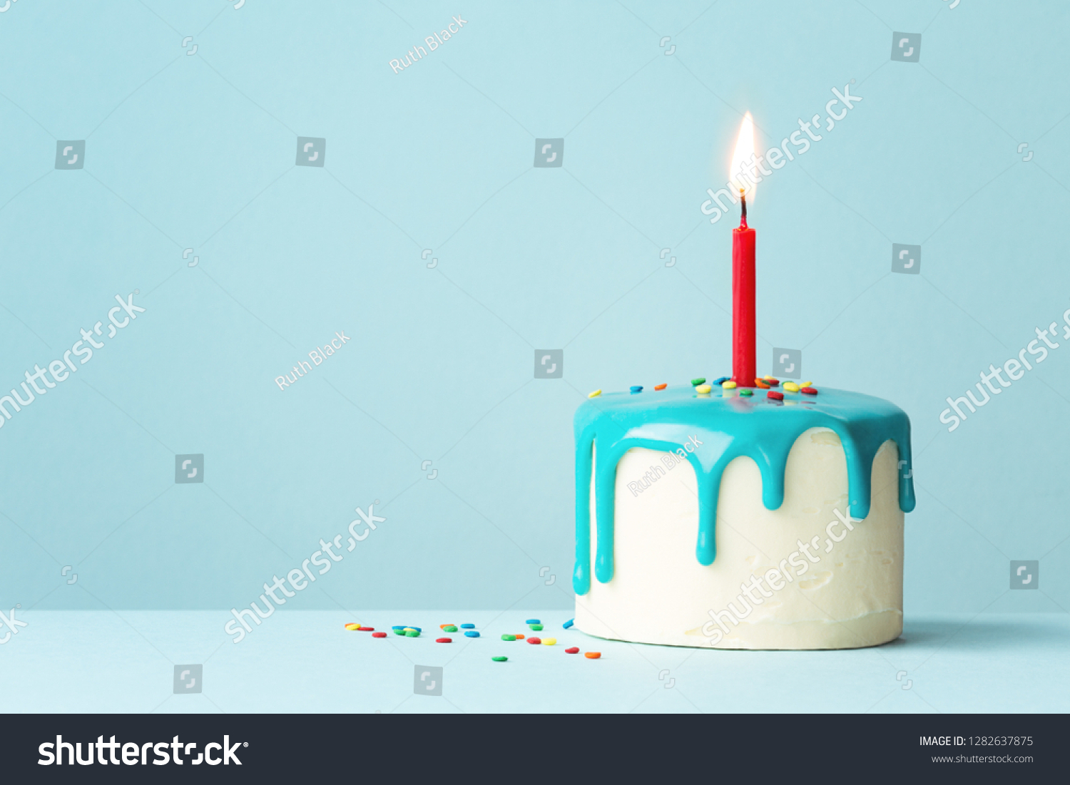 Birthday cake with one red candle and drip frosting #1282637875