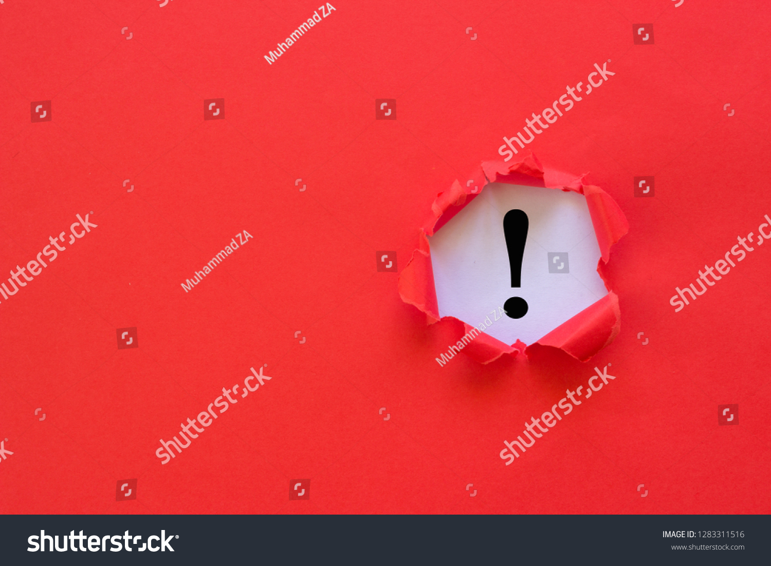 Exclamation mark concept. Torn red paper with exclamation mark on white background. #1283311516