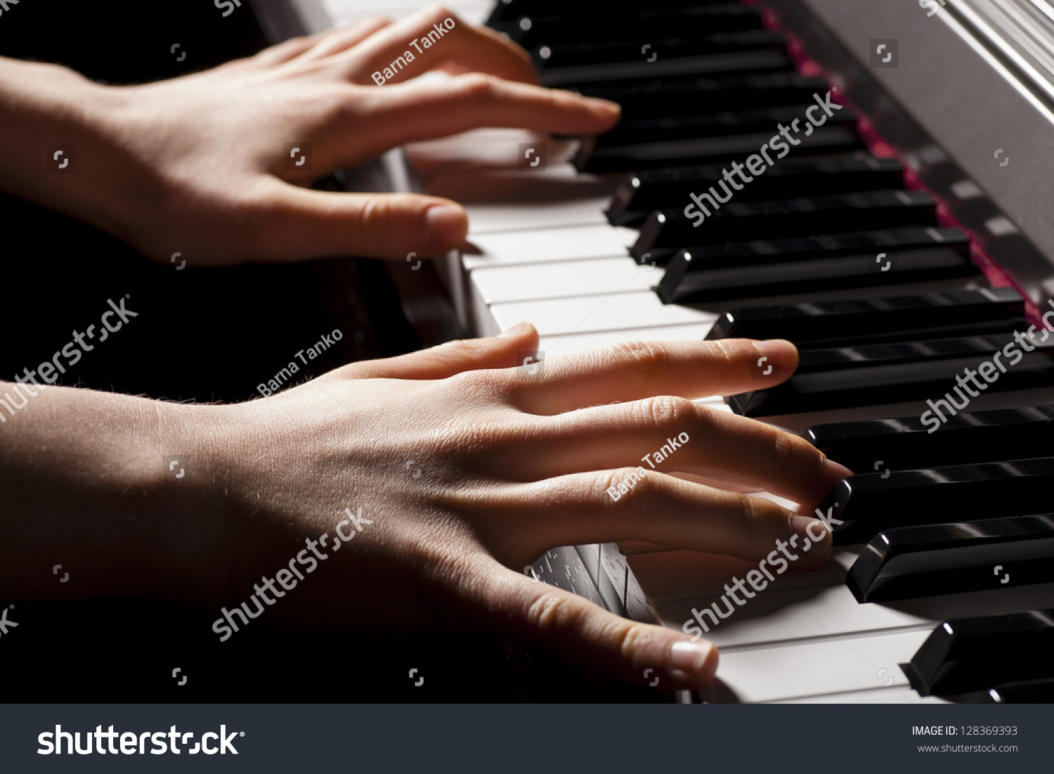 hands playing the piano #128369393