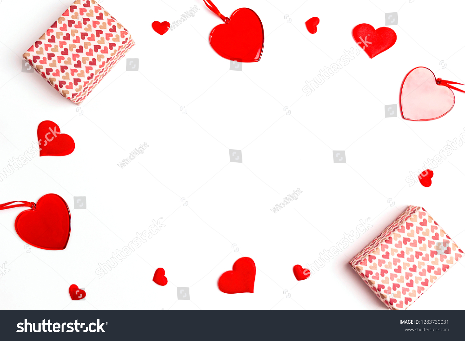 Romantic frame of gifts and hearts on white background. Valentines day background. Flat lay, top view, copy space.  #1283730031