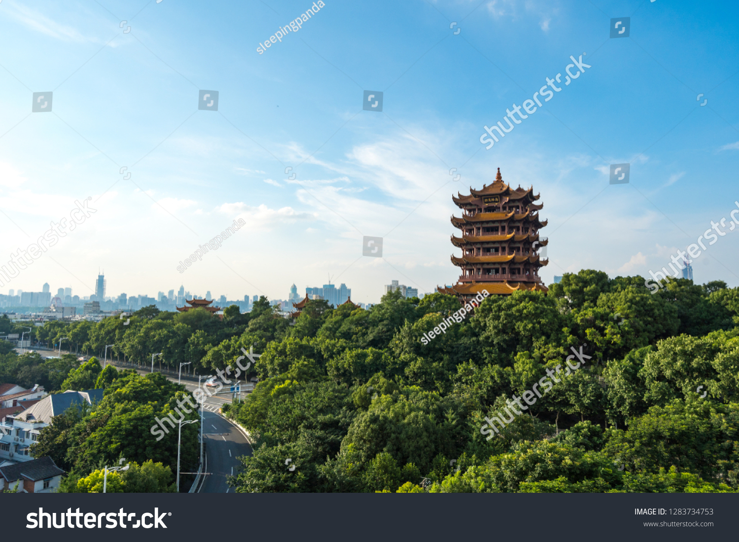 Aerial view of  Wuhan city .The yellow crane tower , located on snake hill in Wuhan, is one of the three famous towers south of yangtze river,China. #1283734753