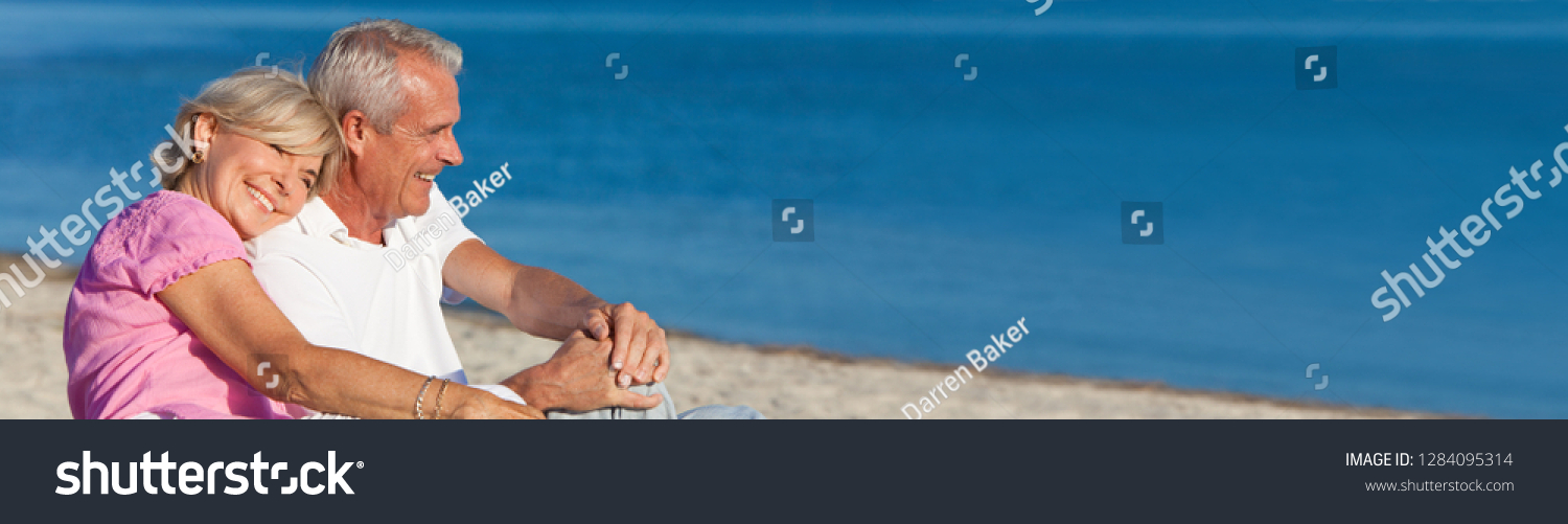 Panorama web banner happy romantic senior man and woman couple together on a deserted beach, s3niorlife #1284095314