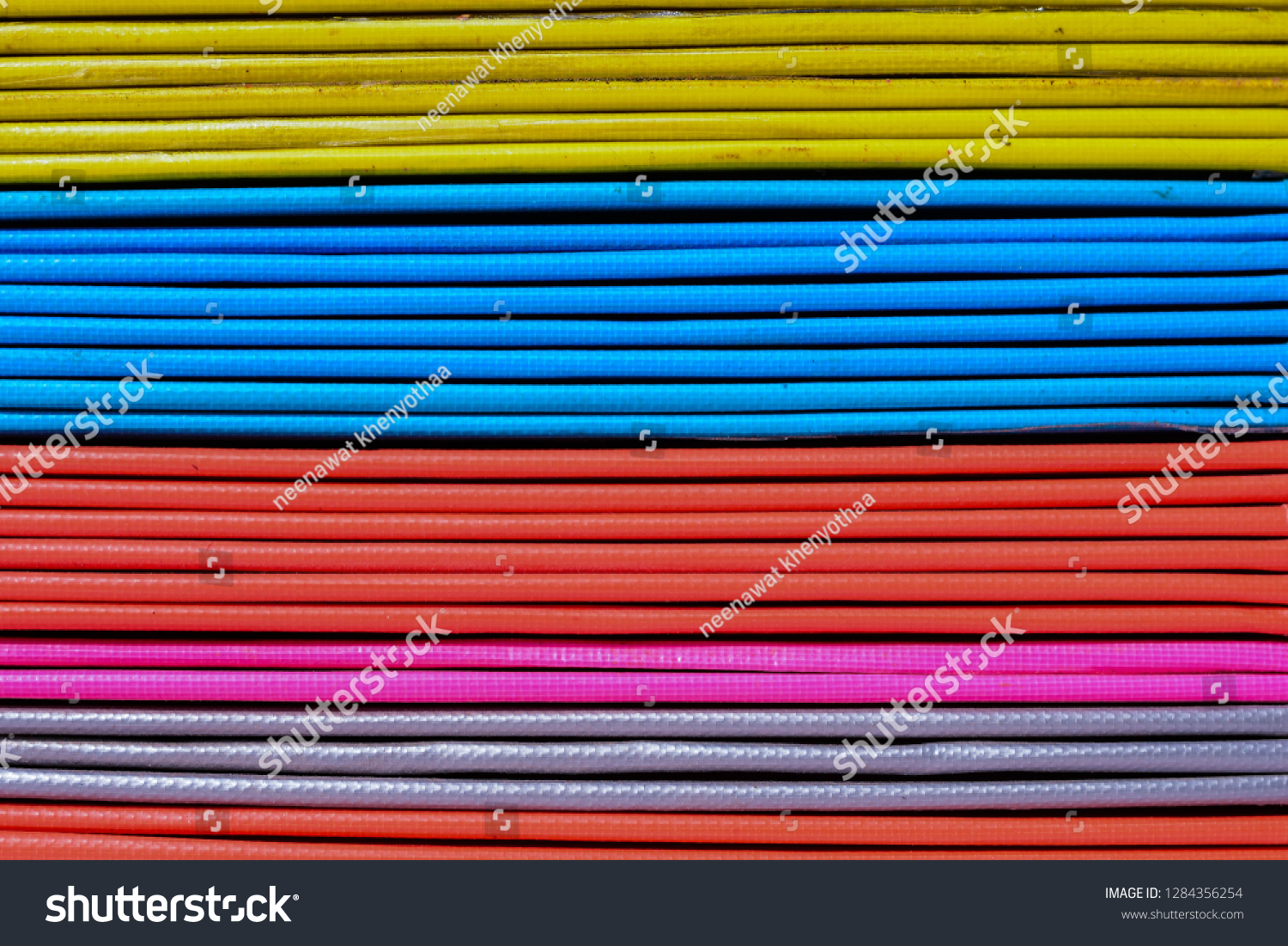 Books or multicolored document files overlapping multiple colors #1284356254
