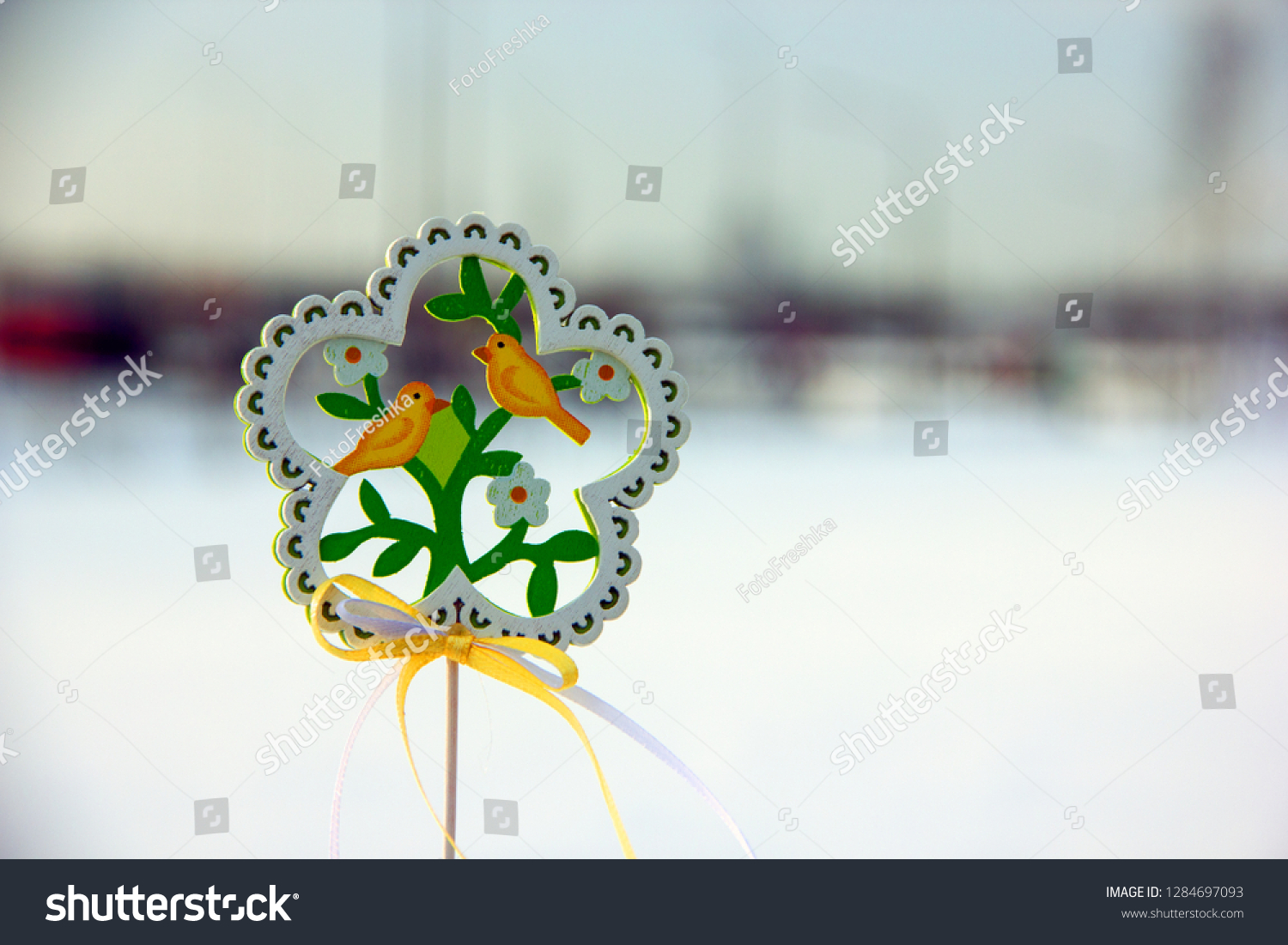 Decorative wooden
element in the form of a flower with birds and flowers on the theme of spring. Background on the theme of spring, waiting for spring, waiting for spring #1284697093