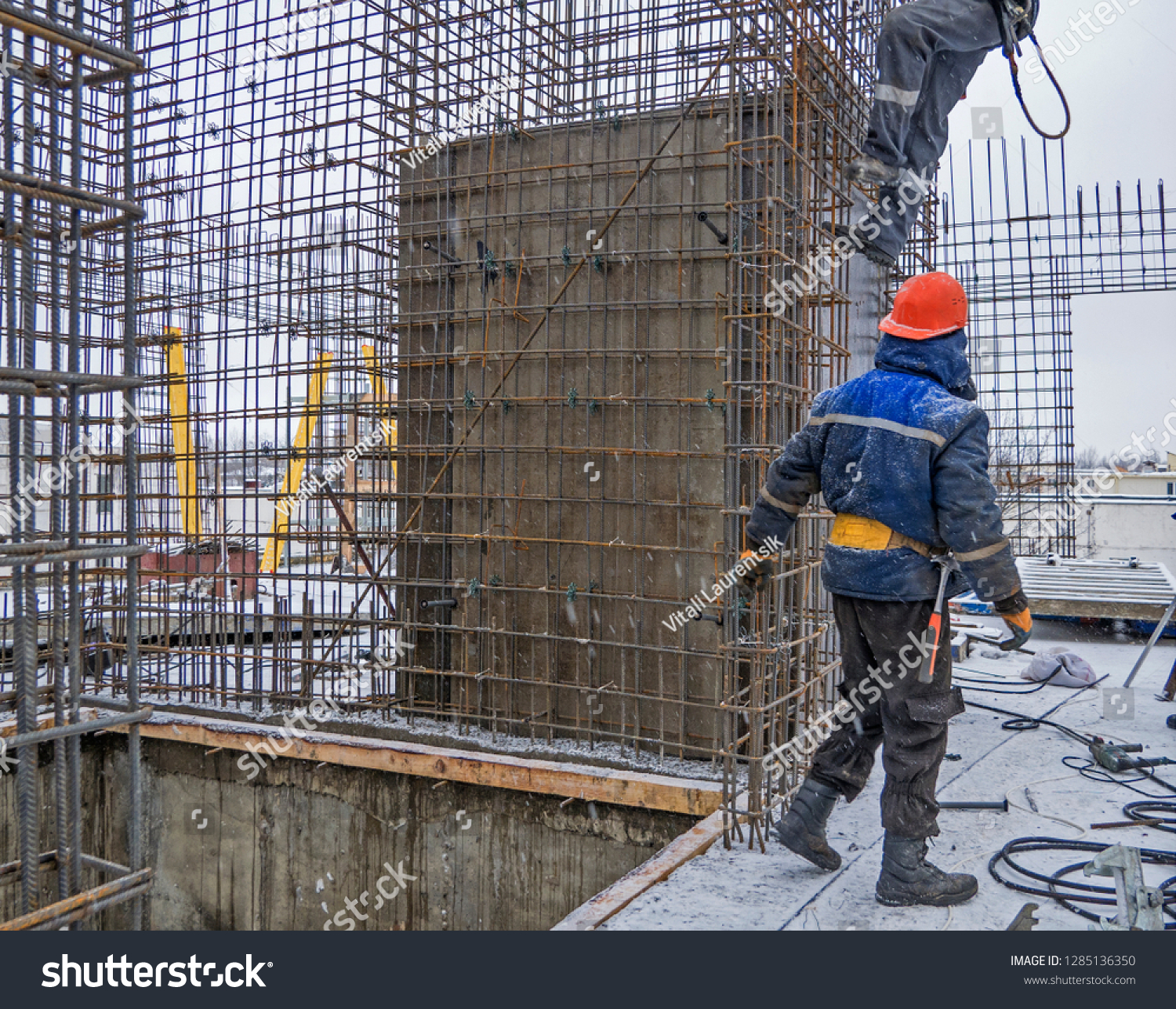 Builder installer on the Construction site #1285136350