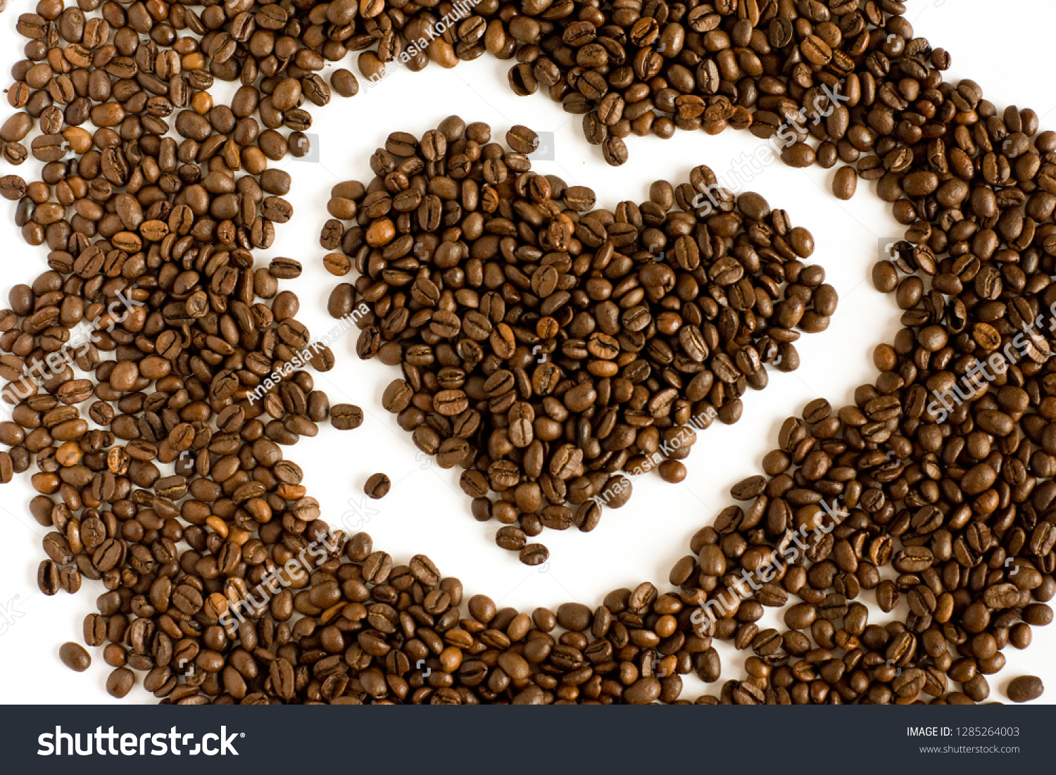 heart of many fresh coffee beans isolated view from above #1285264003