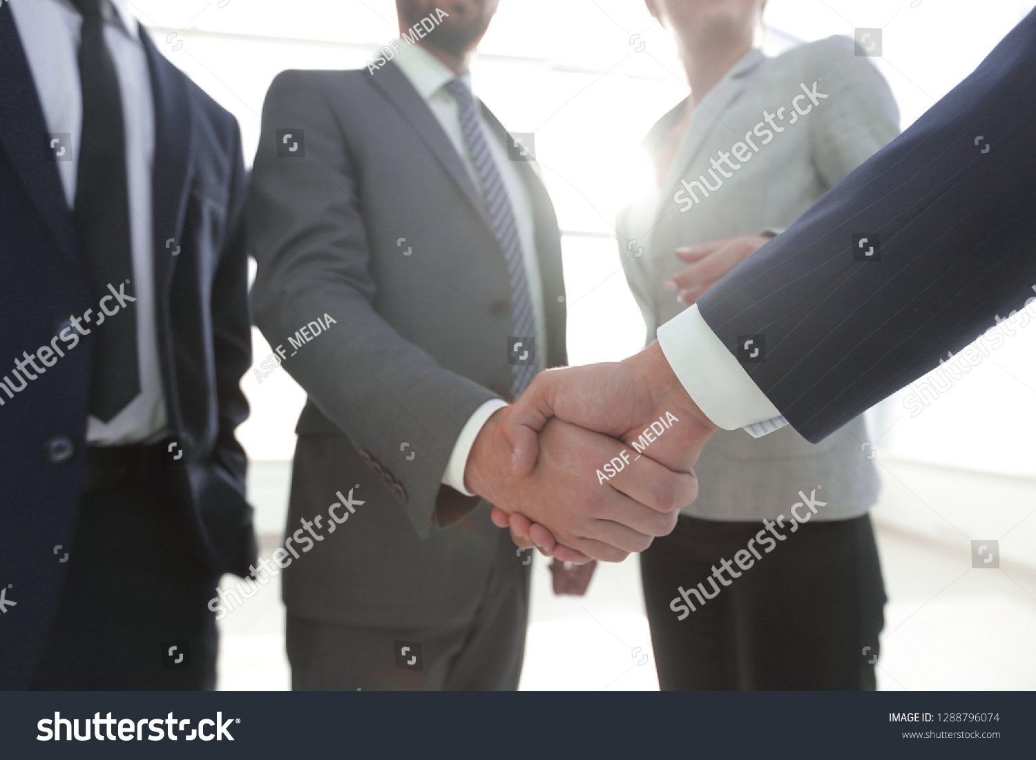 business leader shaking hands with the investor #1288796074