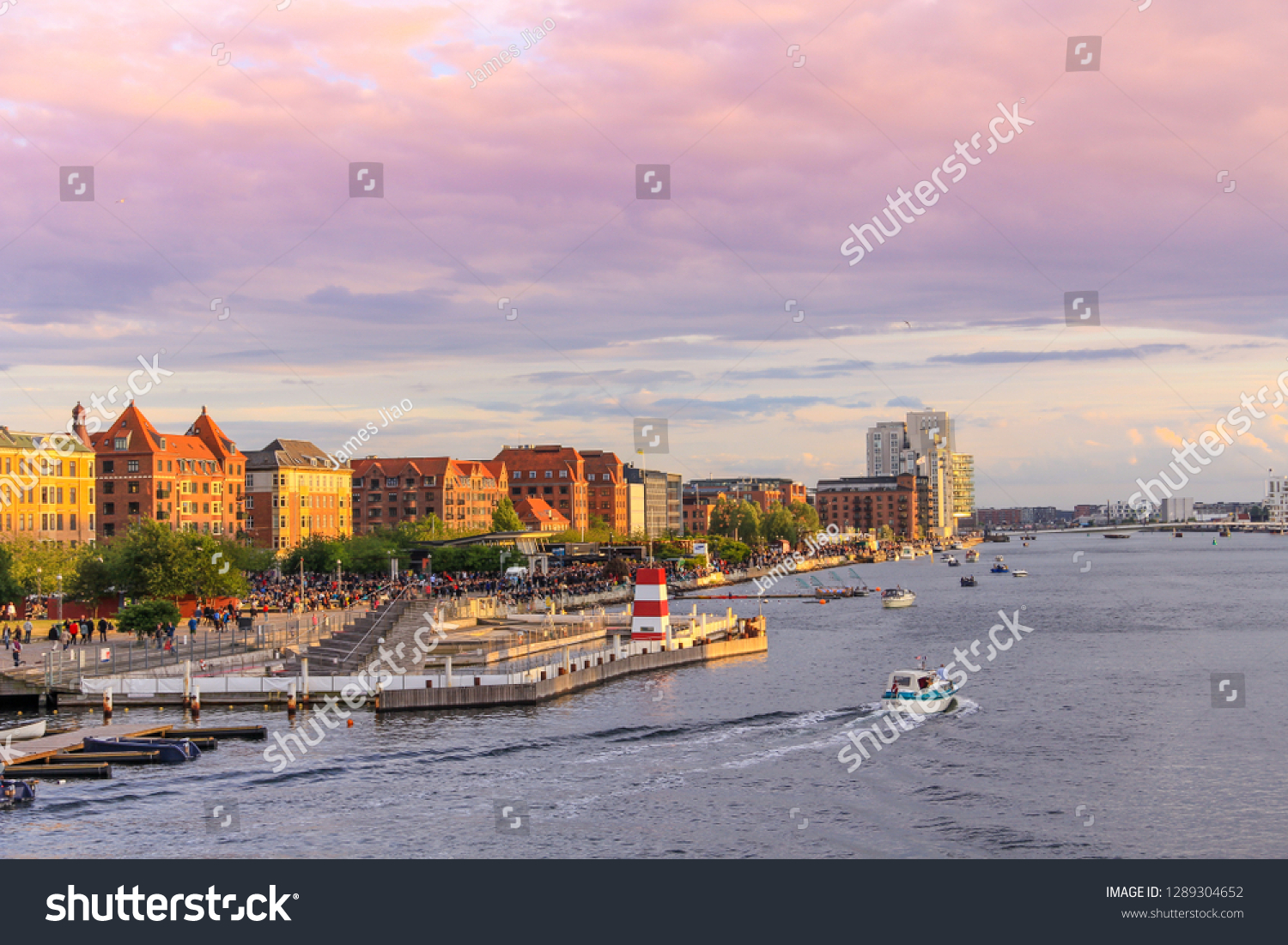 sunset view of buildings along the river near Island Brygge, Copenhagen, Denmark #1289304652