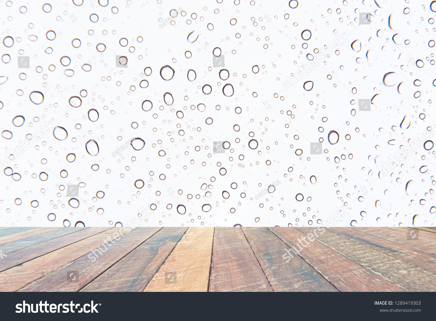Water drops , Rain droplets on white background and empty wood desk .Blank space for text and images. #1289419303