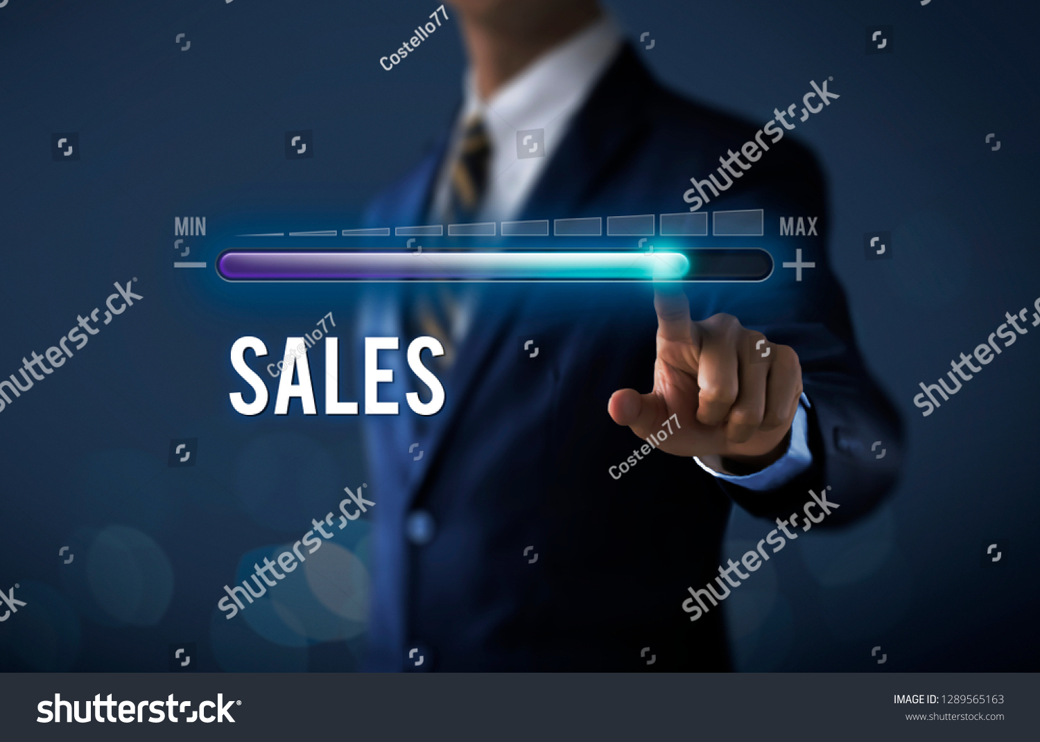 Sales growth, increase sales or business growth concept. Businessman is pulling up progress bar with the word SALES on dark tone background. #1289565163