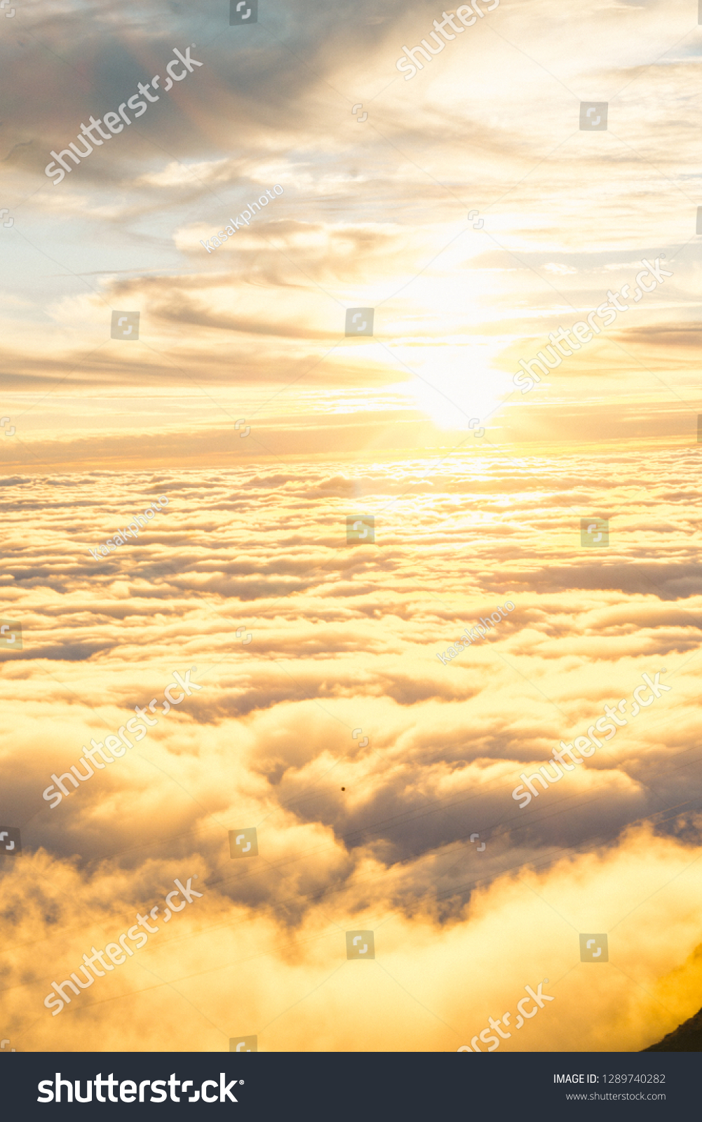 Landscape misty panorama. Fantastic dreamy sunrise on rocky mountains with view into misty valley below #1289740282