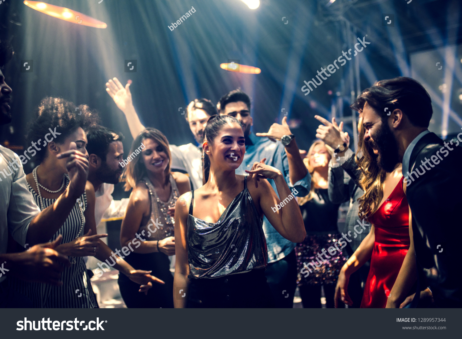 Group of people dancing in the club #1289957344