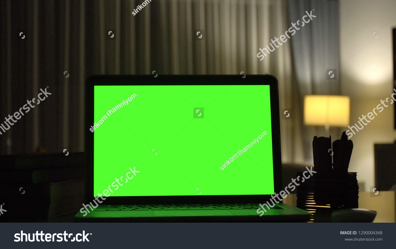 Close-up shot , Laptop with green screen indoors for replacement with blur background  #1290004348