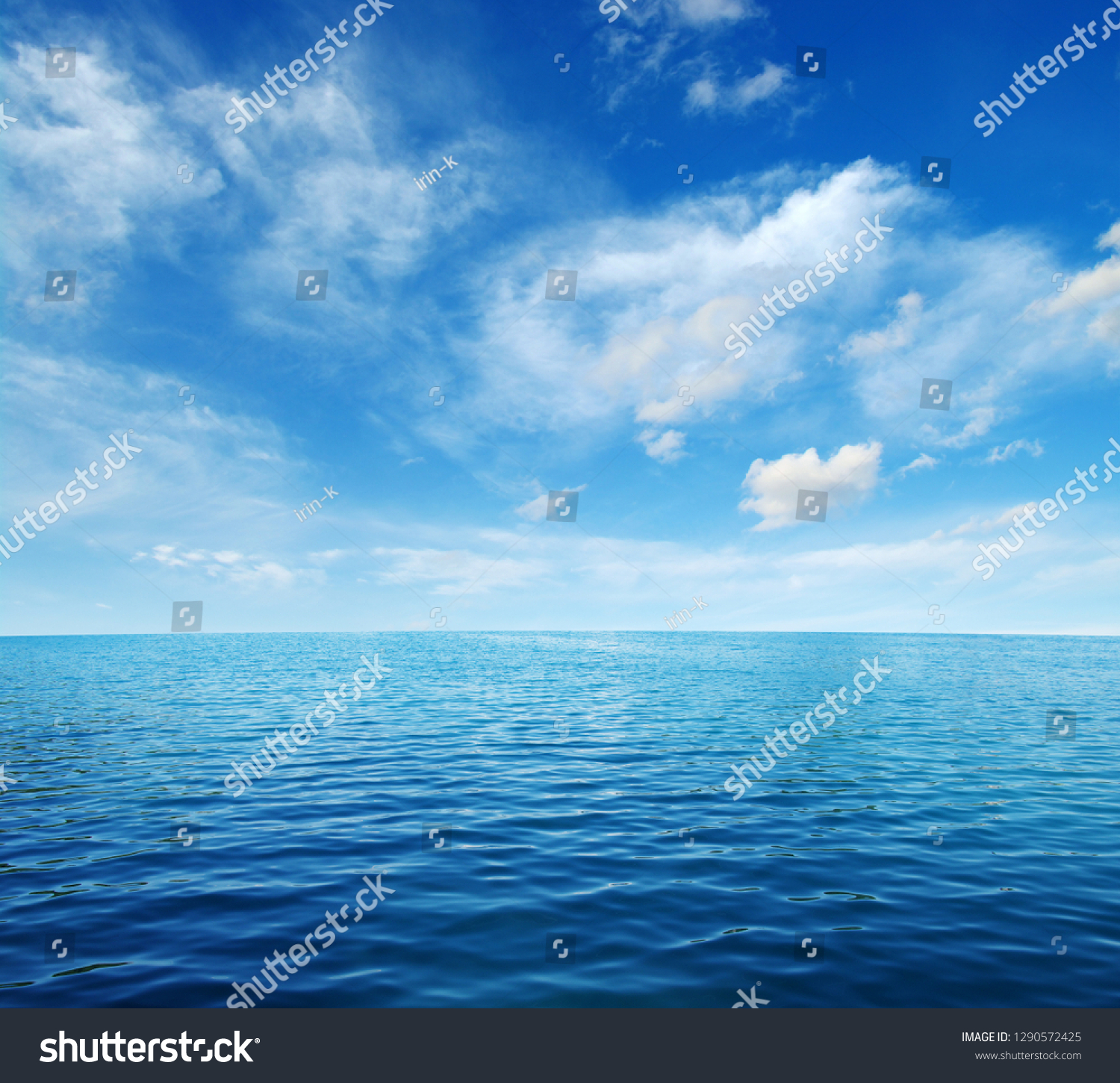 Blue sea water surface on sky #1290572425
