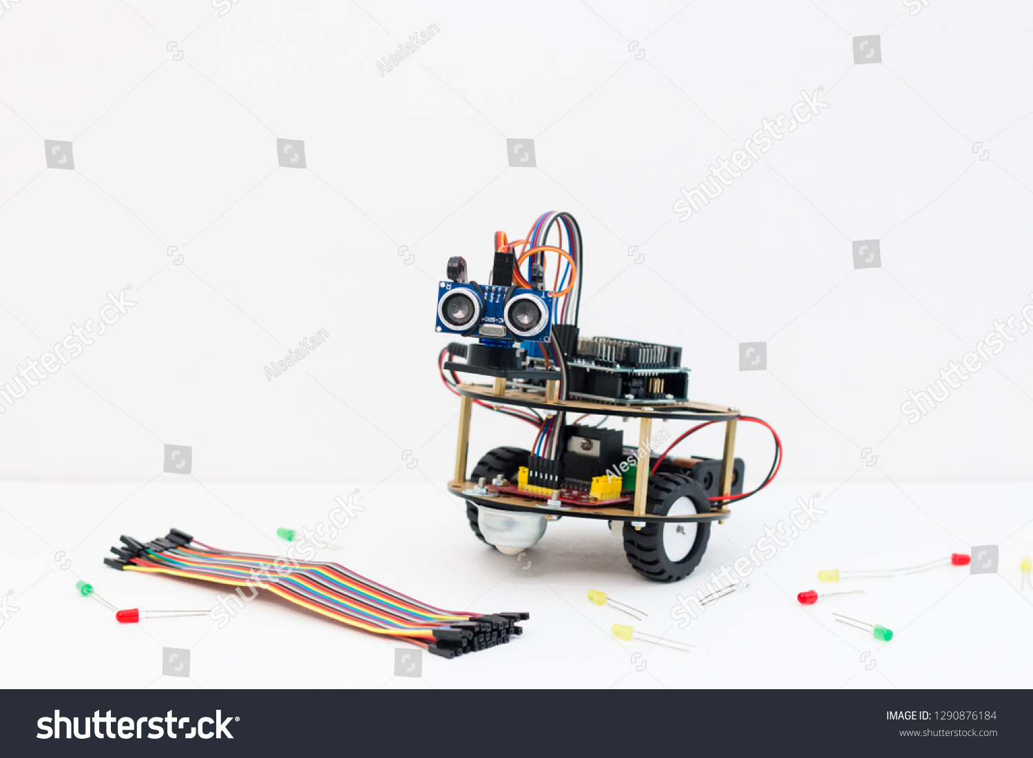 Hand made robot working on the arduino platform. White background. Free space for text. STEM education for children and teenagers, robotics and electronics. DIY. AI. STEAM. #1290876184