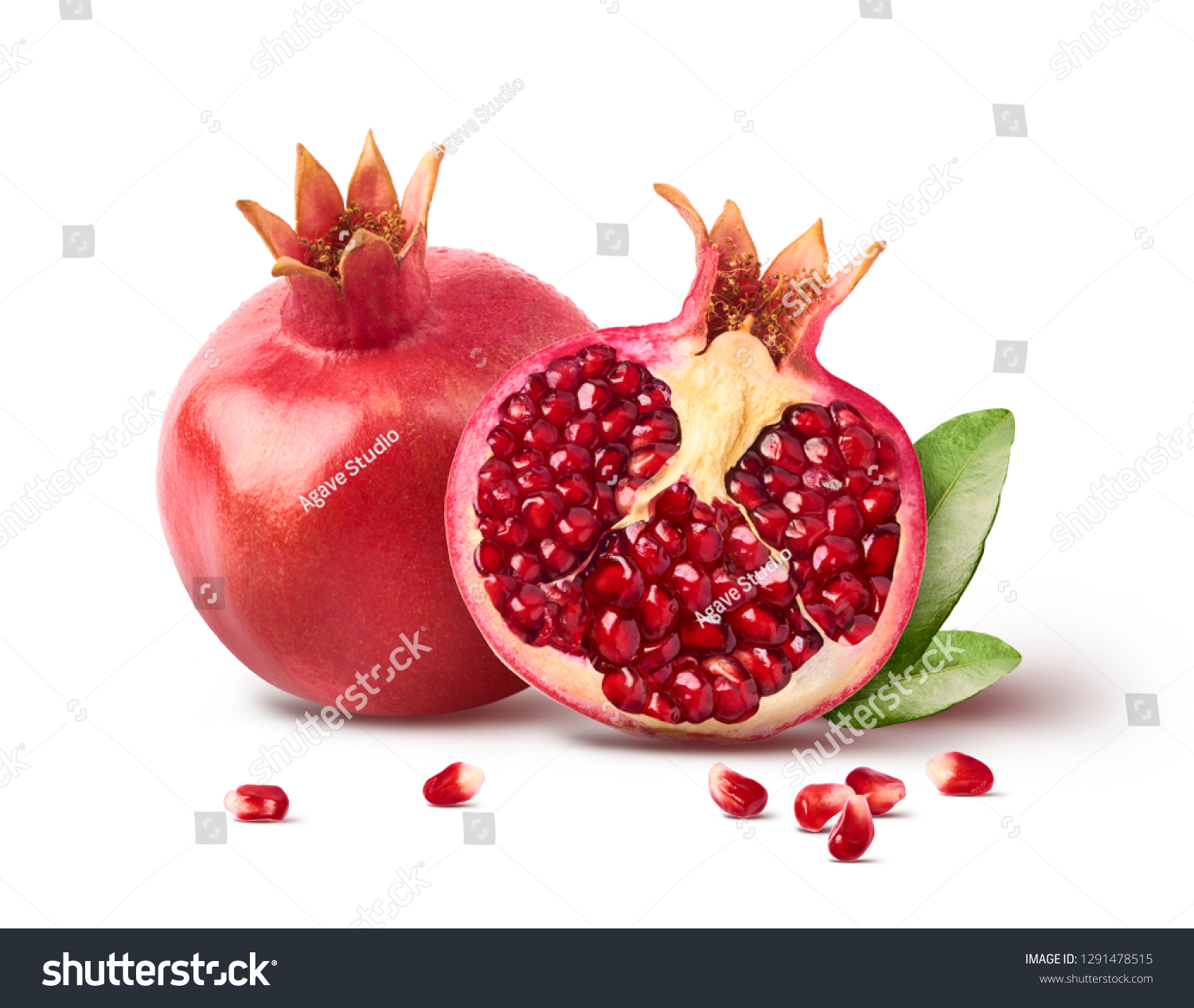 Fresh ripe pomegranate with green leaves isolated on white background. High resolution image #1291478515