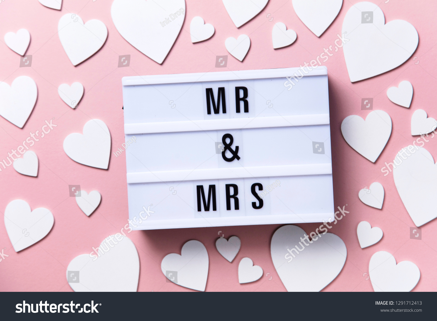 Mr and Mrs lightbox message with white hearts on a pink background #1291712413