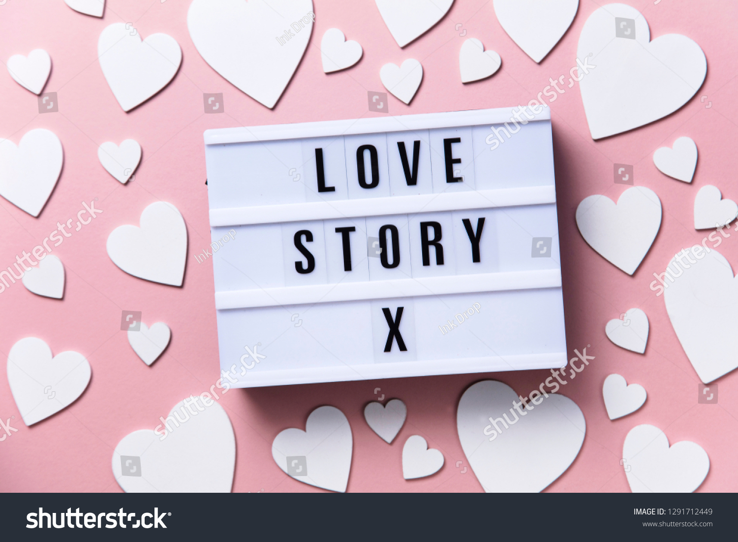 Love story lightbox message with white hearts on a pink background #1291712449
