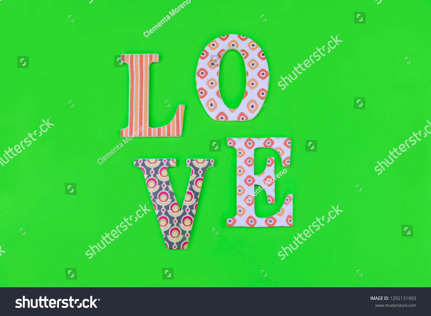 Vintage wooden love letters on green background with copy space. Romanticism concept. #1292131993