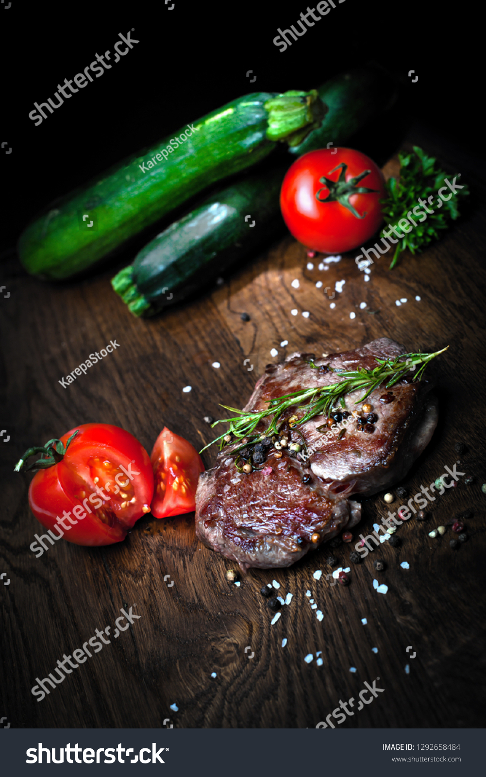 Juicy steak medium rare beef with spices and grilled vegetables. Top view #1292658484