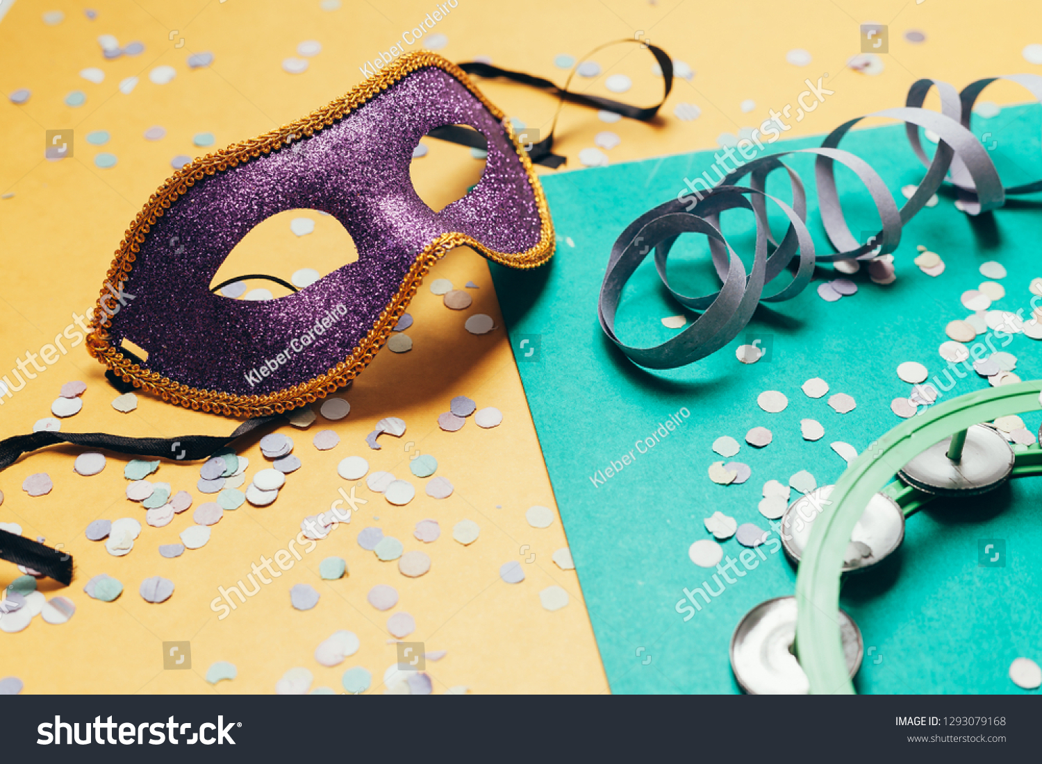 Brazilian Carnival concept. Mask and confetti on over background #1293079168