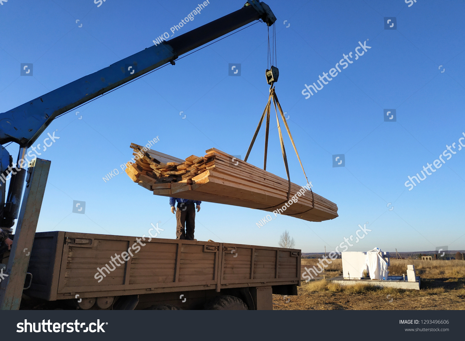 load boards supplied to the construction site with a crane, manipulator #1293496606