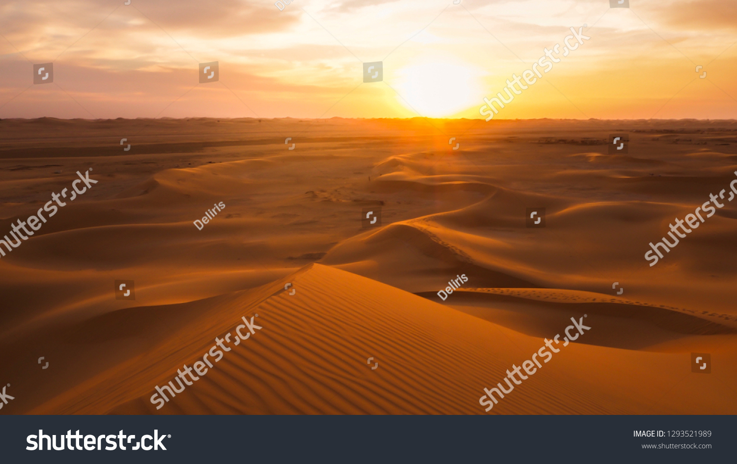 Amazing desert sunset. Beautiful arabian desert with warm colors. Colorful contours of sand dunes at Abu Dhabi.  #1293521989