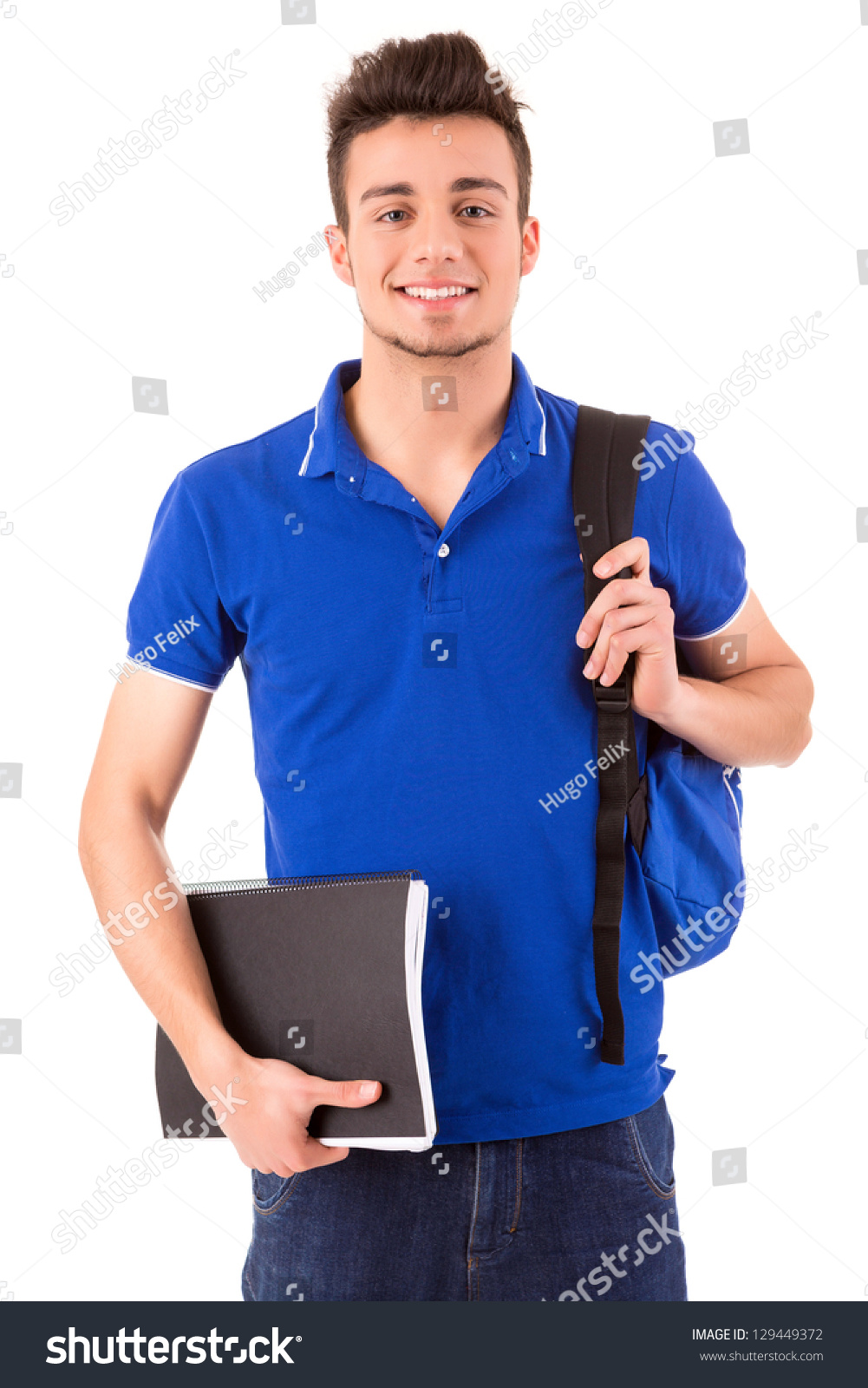 Young happy student posing isolated over white background #129449372