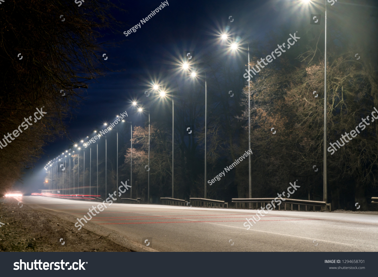 street lighting, supports for ceilings with led lamps. concept of modernization and maintenance of lamps, place for text, night. winter season. energy-saving lamps, safety of movement #1294658701