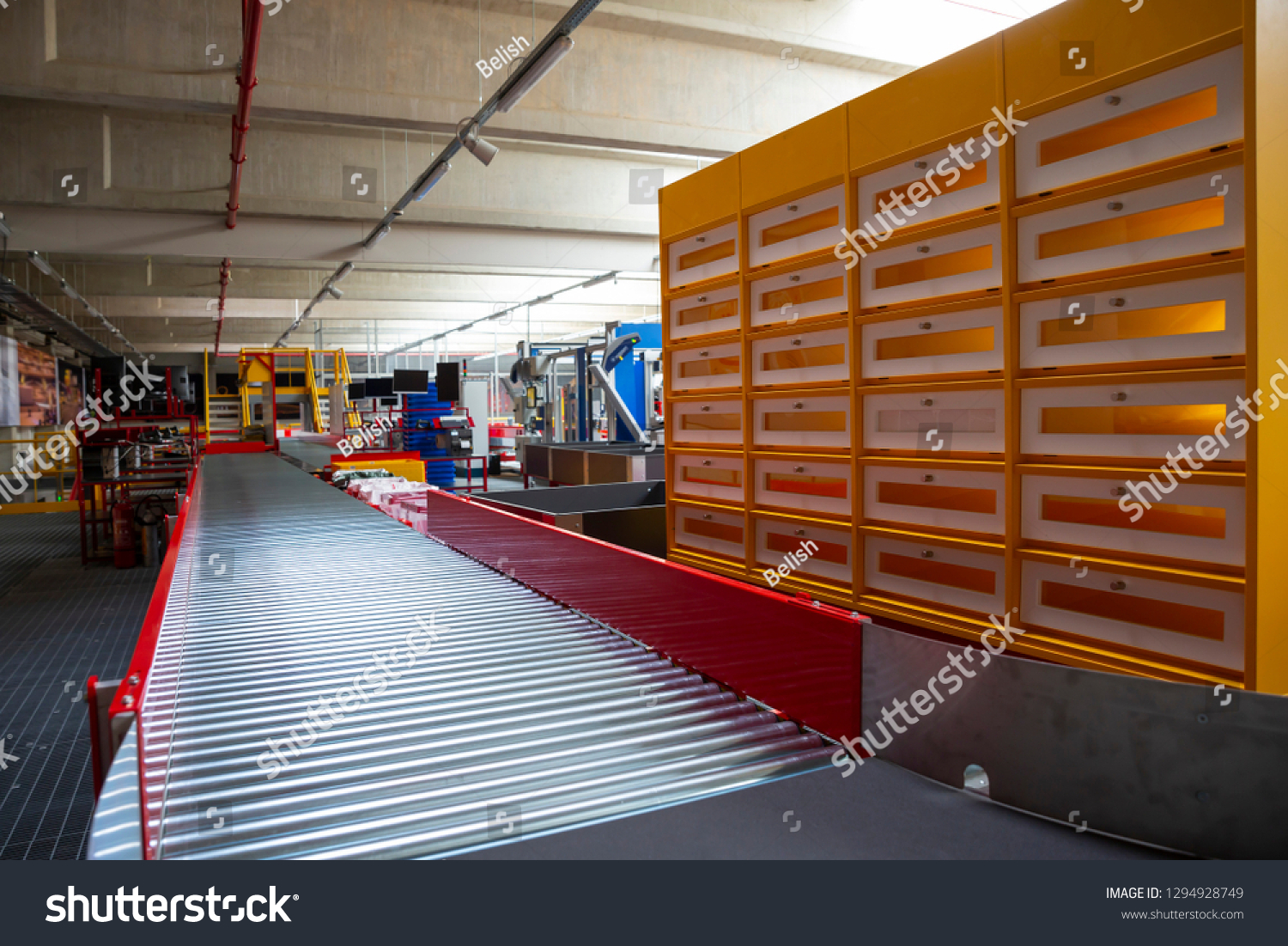 Empty conveyor sorting belt at distribution warehouse. Distribution hub for sorting packages and parcels delivered by air transportation. #1294928749
