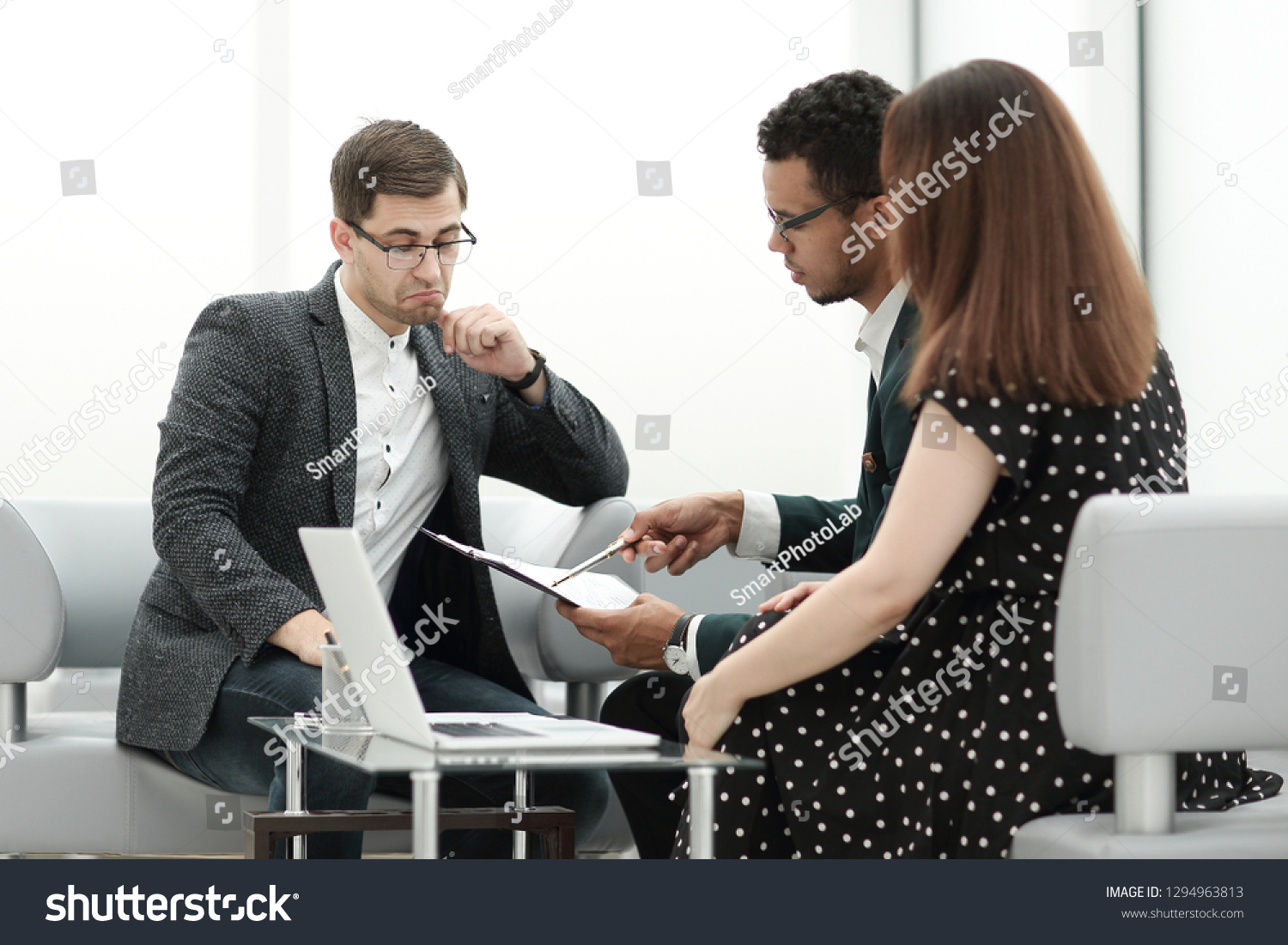 lawyer and a couple discussing the terms of the contract #1294963813
