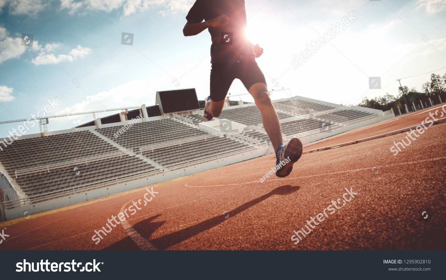 Sport Backgrounds, Male runner ready for sports exercise, Athlete running on athletic track. #1295902810
