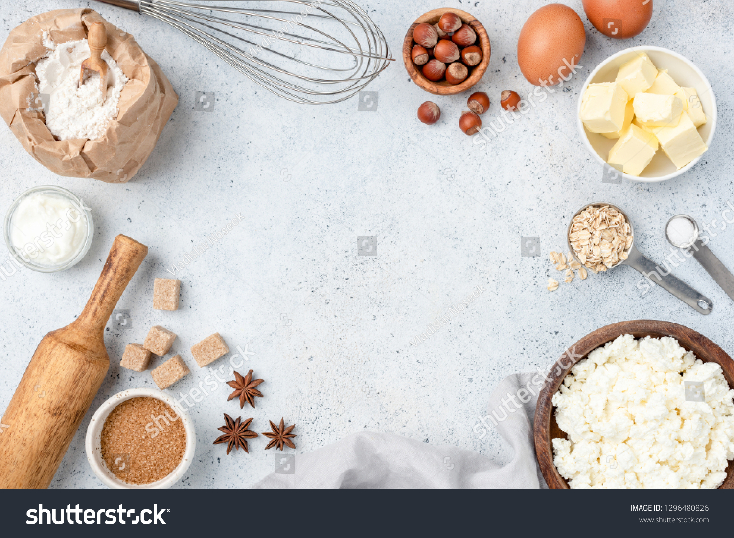 Baking concept, baking ingredients on background. Ingredients for baking cake, cookies, bread or pastry. Frame of cooking kitchen utensils and food #1296480826