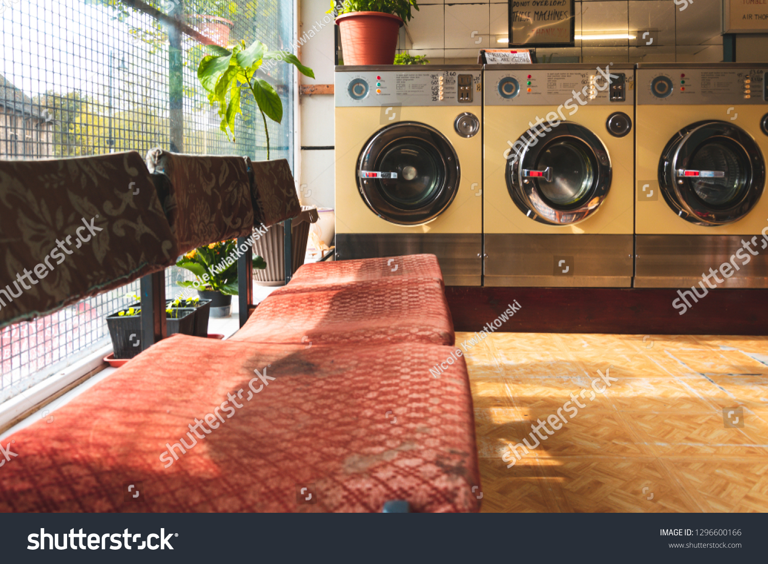 Coin-operated washing machines at a vintage laundromat #1296600166
