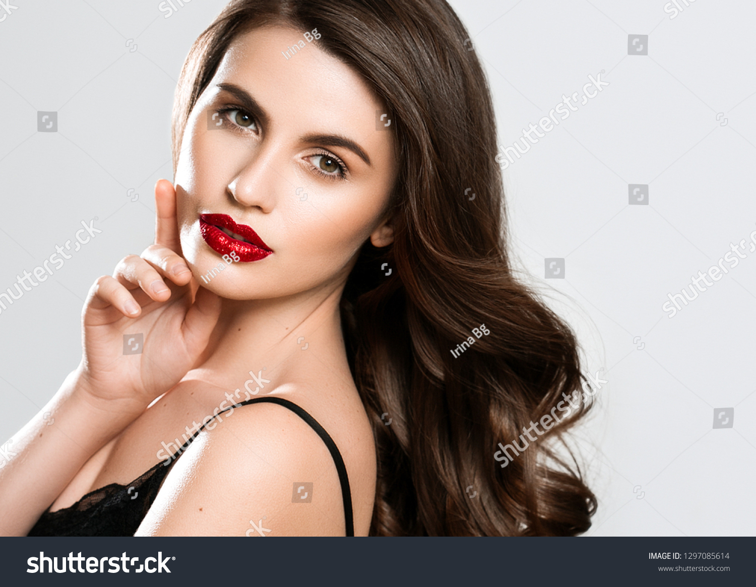 Beauty Woman face Portrait. Beautiful Spa model Girl with Perfect Fresh Clean Skin. Brunette female looking at camera and smiling on gray background. Beautiful hairstyle Youth and Skin Care Concept #1297085614