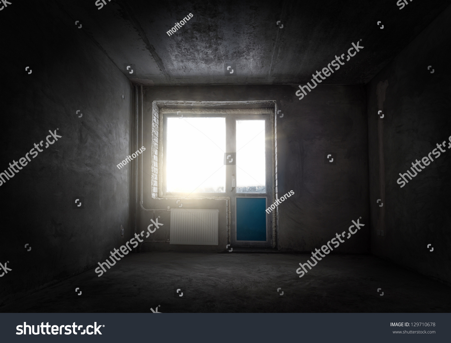 Grungy empty room with gray walls and a window #129710678