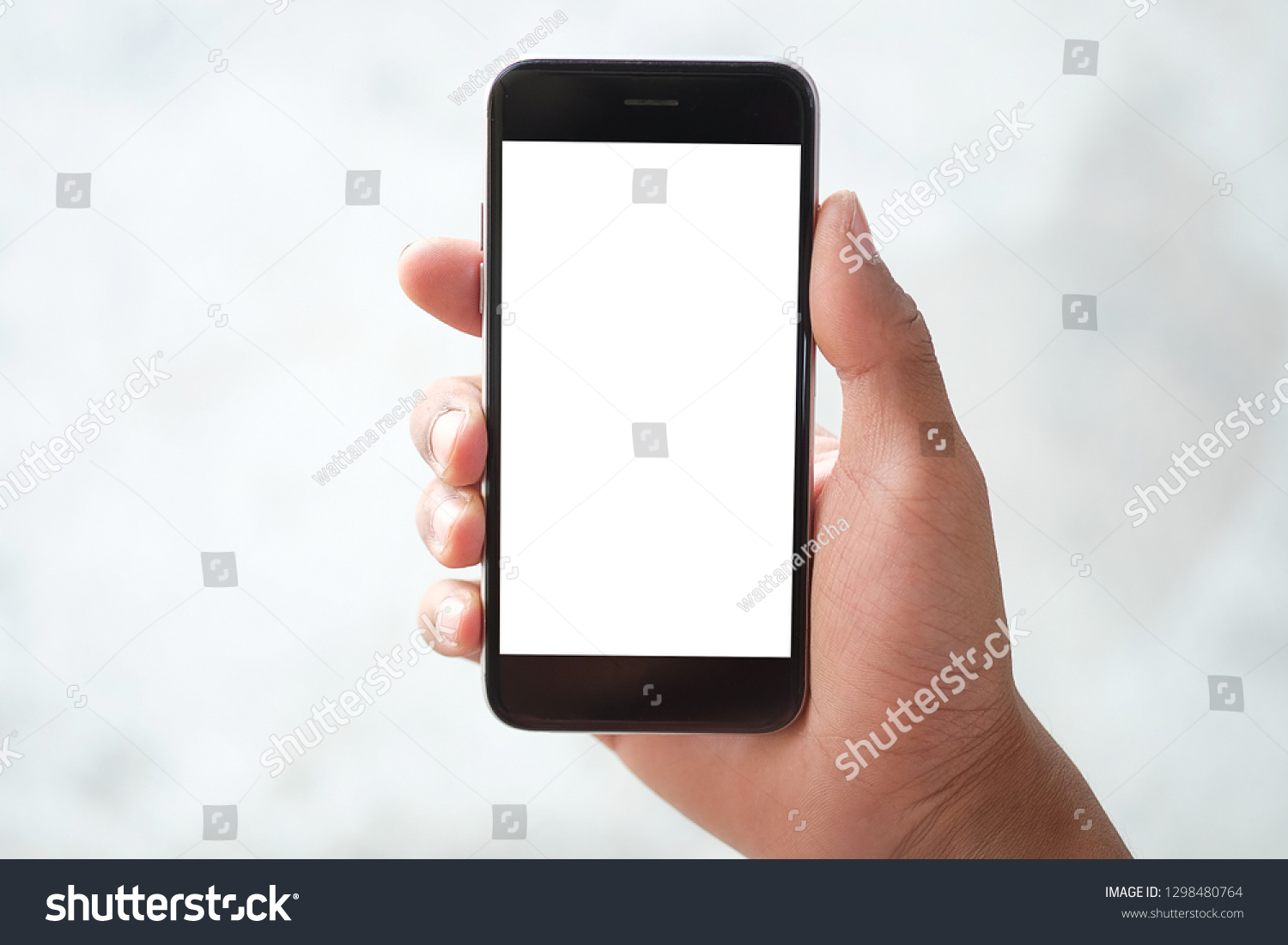 Cropped shot view of man hands holding smart phone with blank copy space screen for your text message or information content, female reading text message on cell telephone during in urban setting.  #1298480764