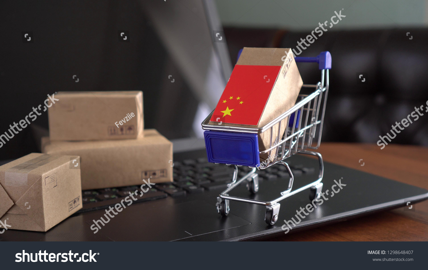 Parcel Boxes with a flag of China in a shopping cart. Duty, customs fee, customs tax, customs payment, custom duties. International Trade in Goods and Services by Country  #1298648407