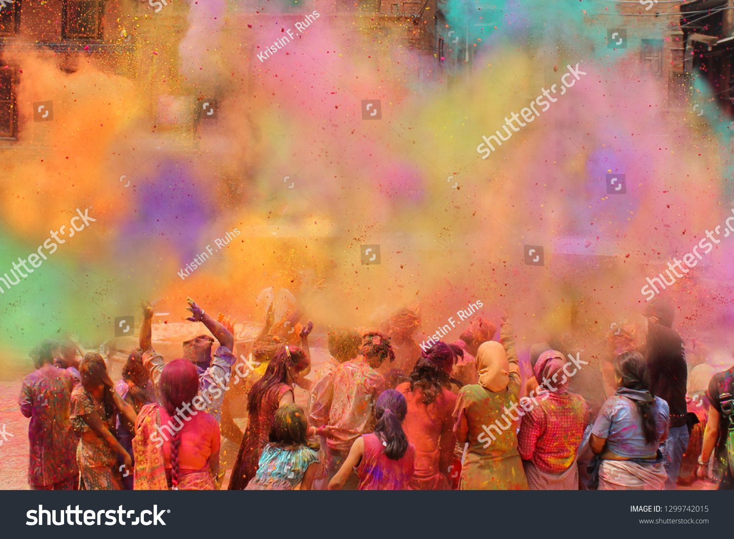 People celebrating the Holi festival of colors in Nepal or India #1299742015