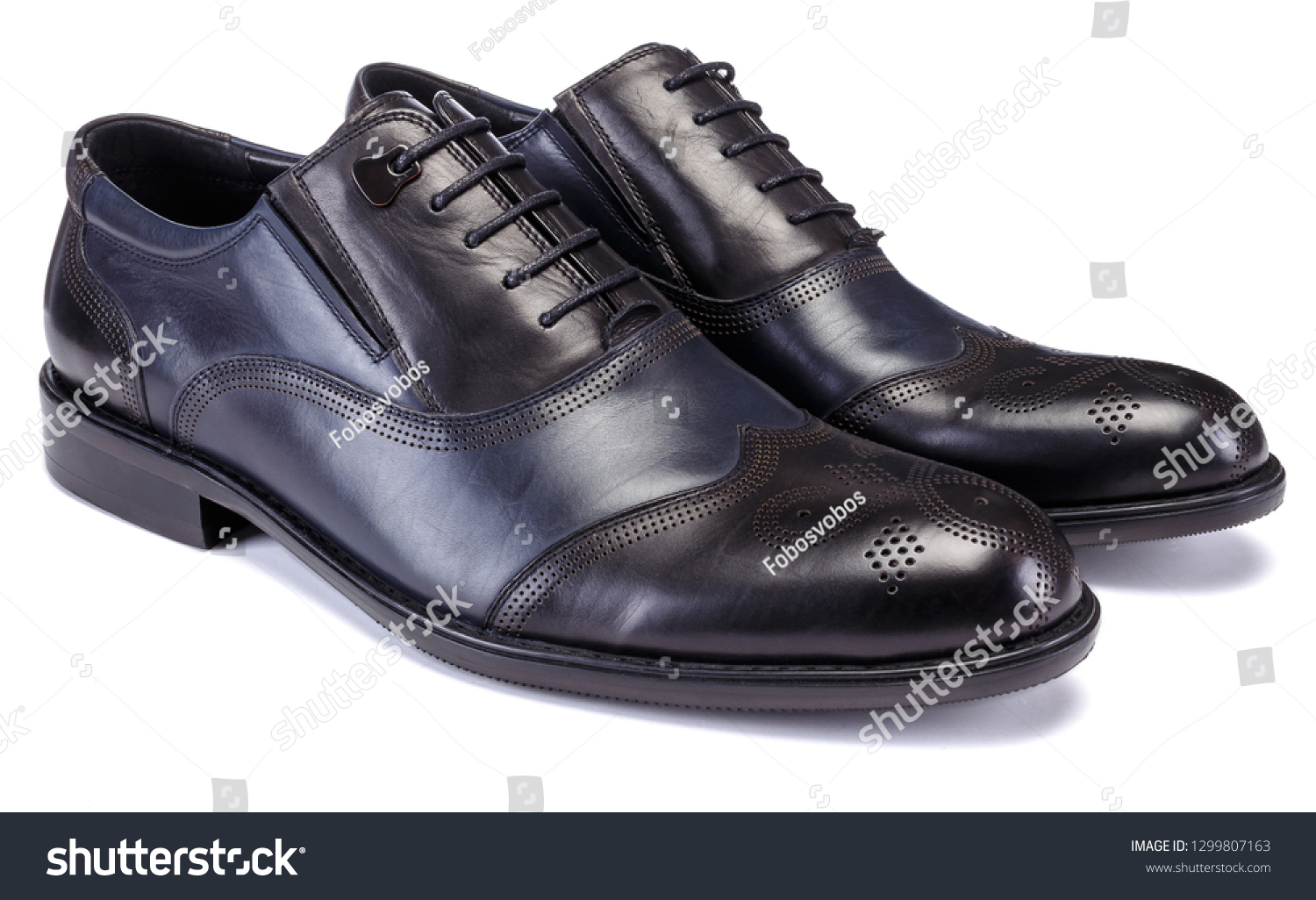 Black shoe for male on white background. #1299807163